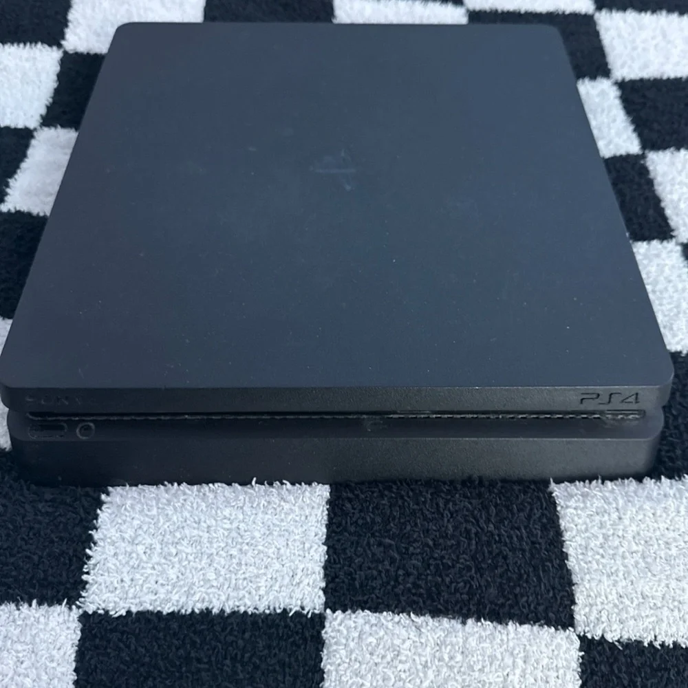Sony PS4 Console - Black Comes with a Orange and Navy blue controller.